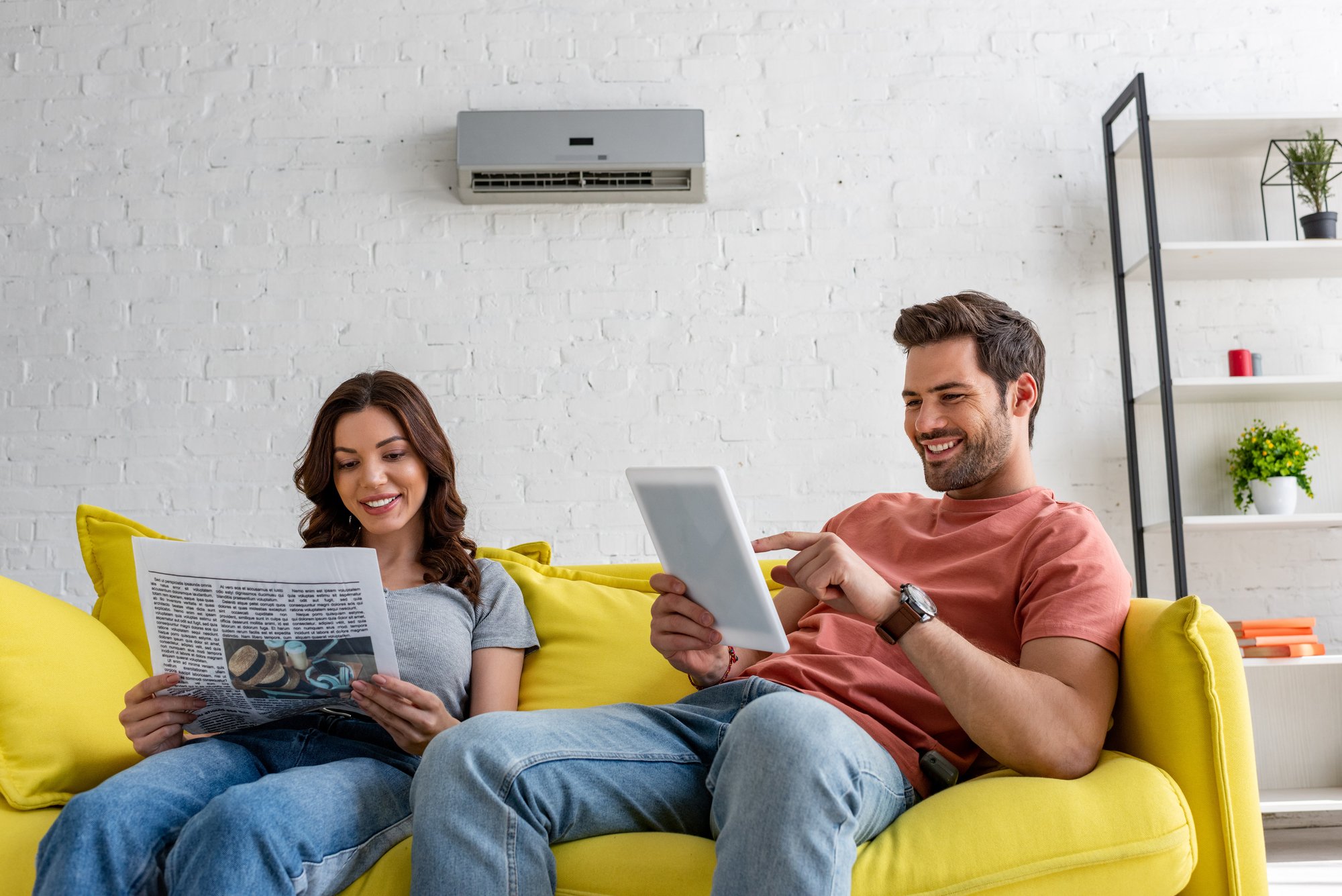 couple in front of their hvac system