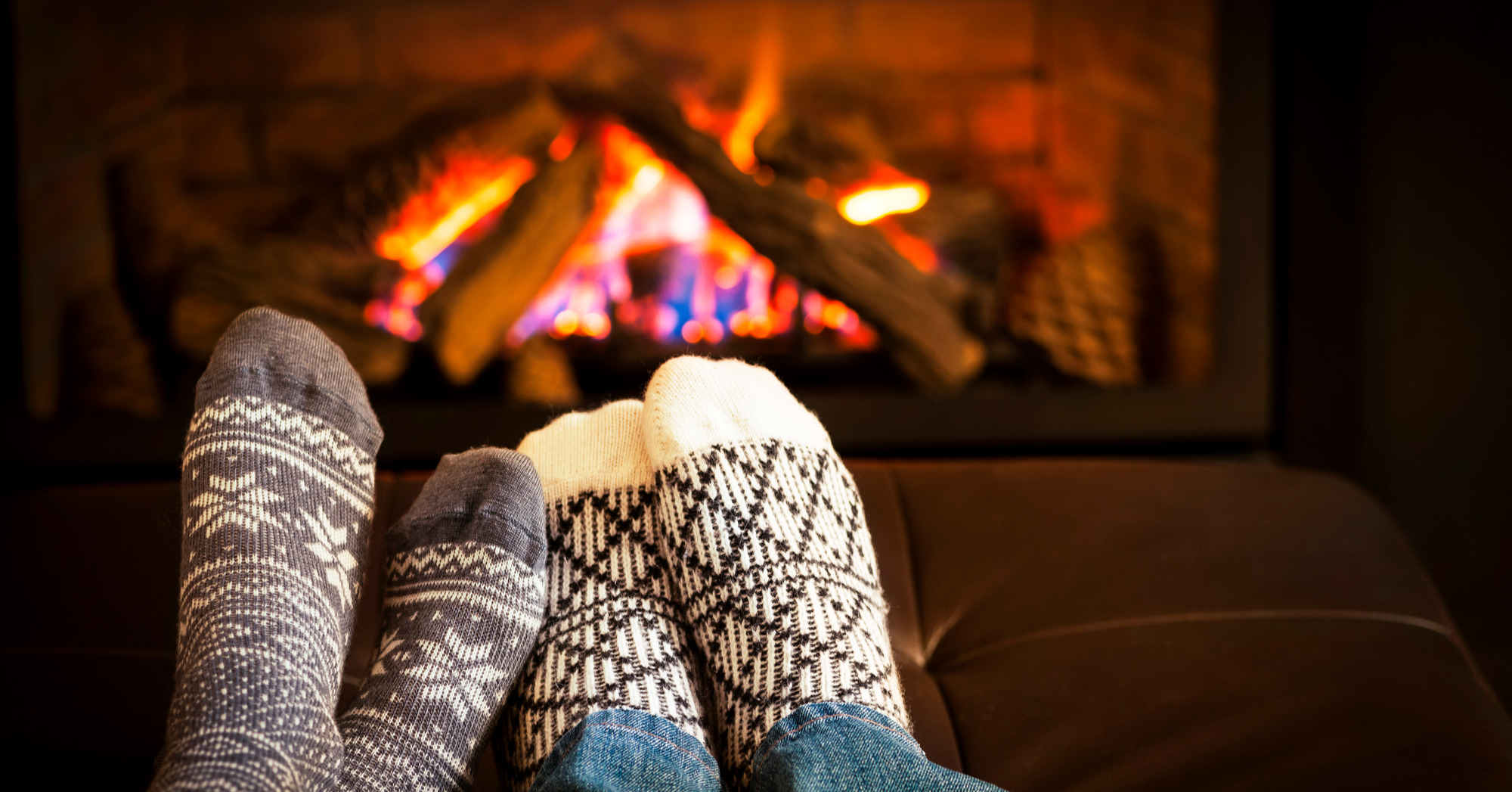 Feet warming by fireplace