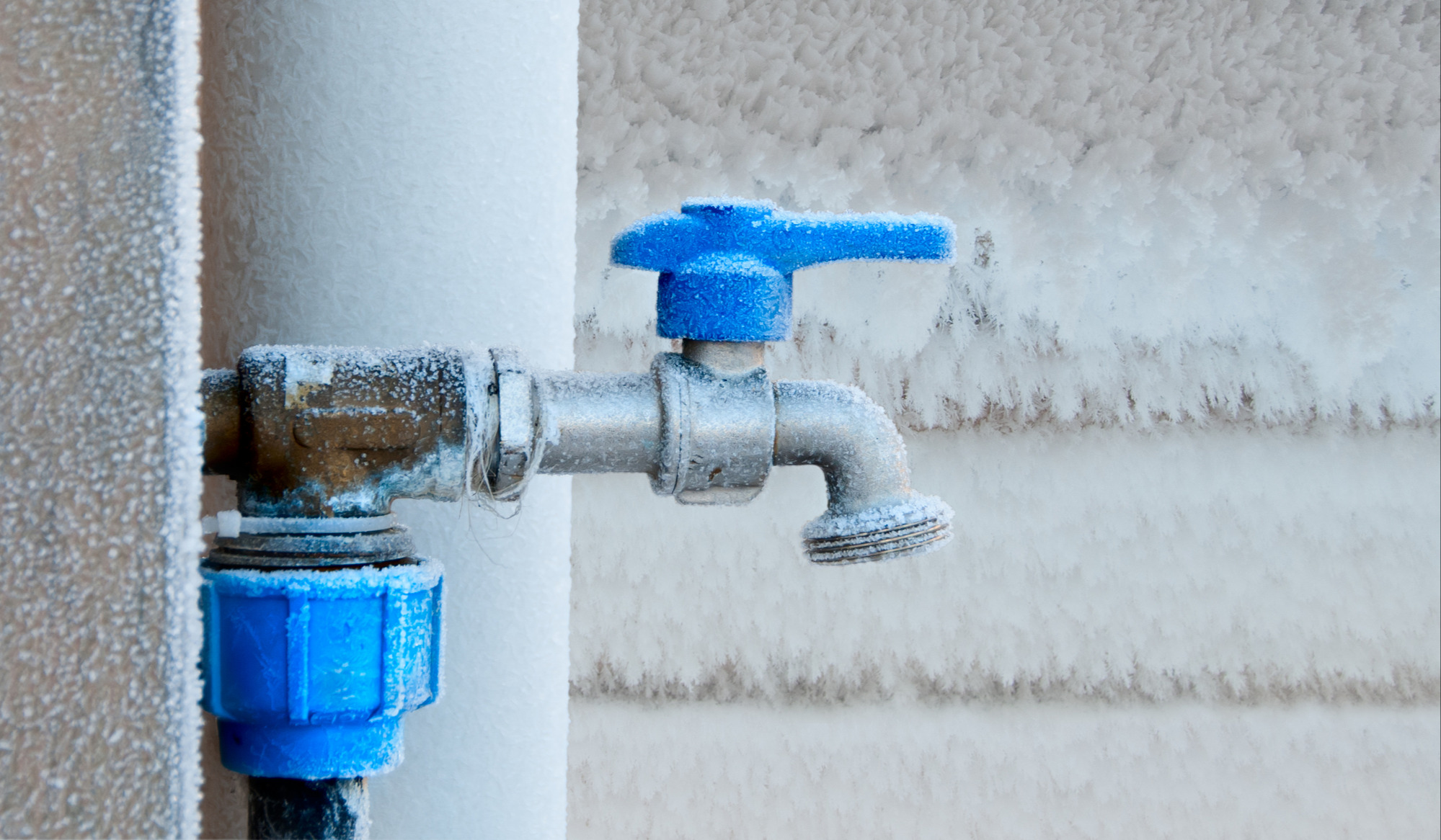 Frozen faucet in winter