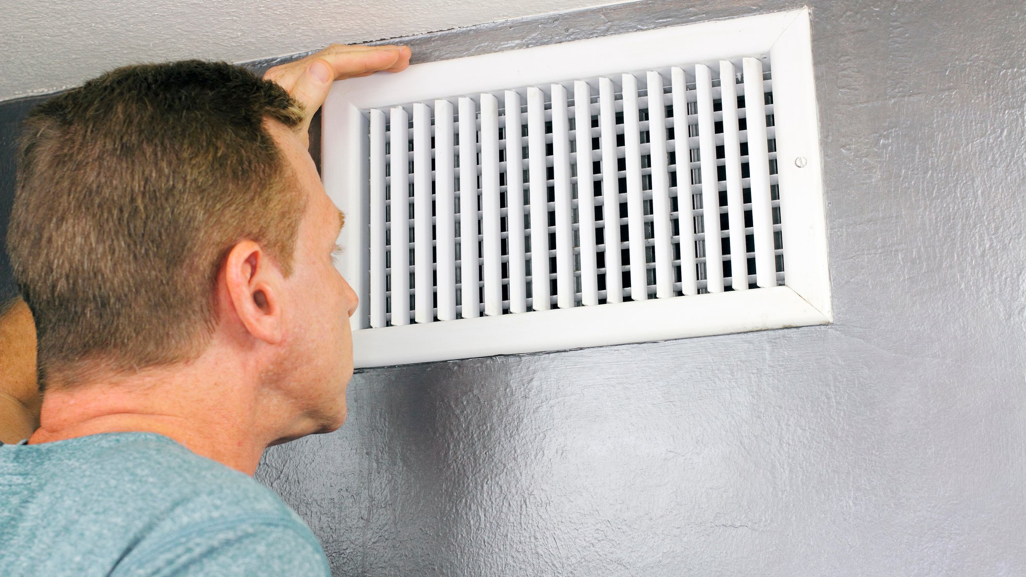 Inspecting a Home Air Vent for Maintenance