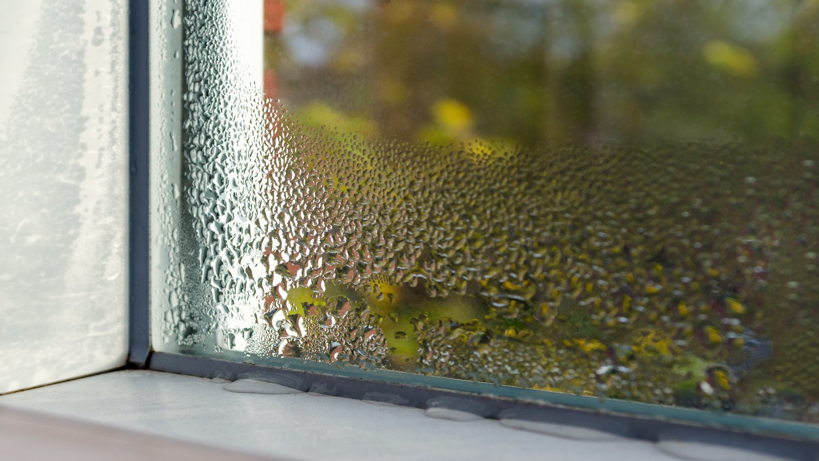 Window with water drops from humidity