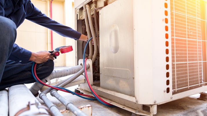 Technician is checking air conditioner